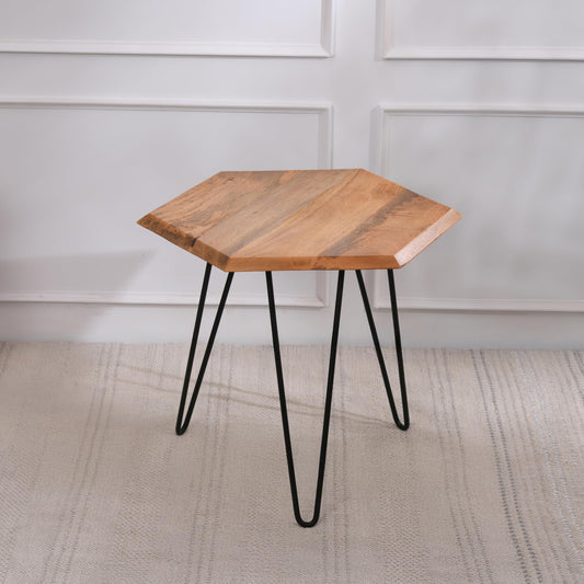 WOOD CURLS Vivo hexagon side table with natural mango wood top and black iron hairpin legs on a neutral rug.