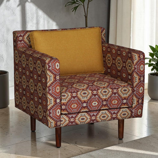 WOOD CURLS accent armchair featuring a vibrant geometric Ikat fabric pattern, mustard yellow cushion, and wooden legs.