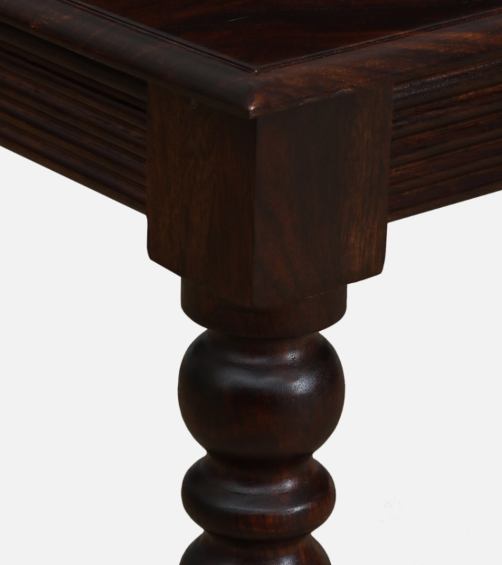 WOOD CURLS Arwen dining table corner featuring solid Sheesham wood with a rich Provincial Teak finish and turned legs.