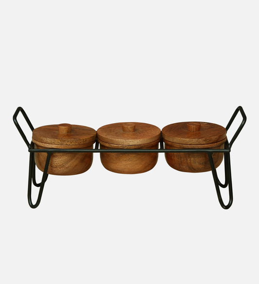 WOOD CURLS set of 3 handcrafted solid wood serving bowls with lids arranged on a black metal stand for snacks.