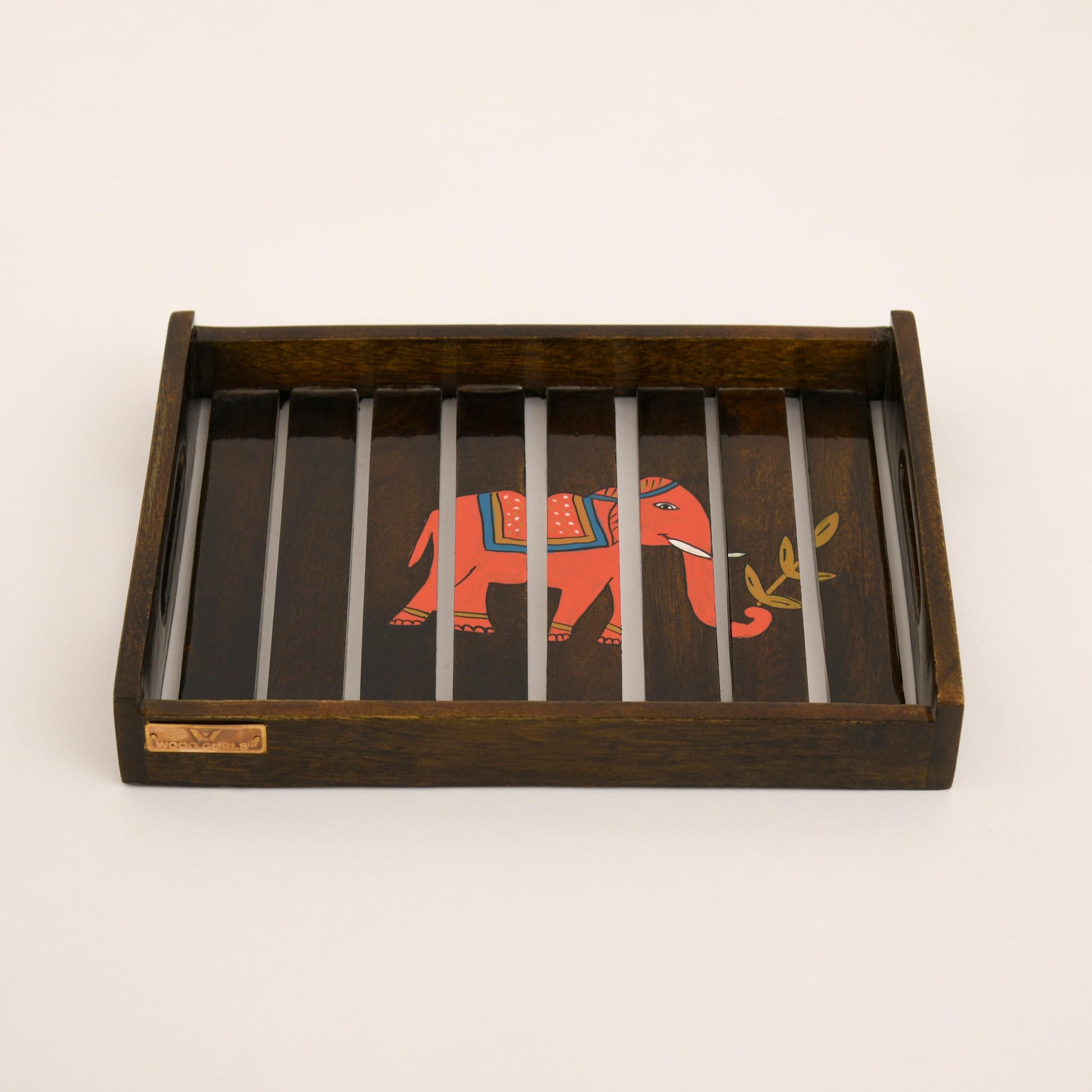 mango wood elephant serving tray

handcrafted wooden decorative tray

wooden tea snack serving tray

elephant design kitchen tray