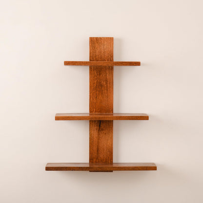 WOOD CURLS 3-tier wall-mounted shelf made from natural brown mango wood with a minimalist vertical design.