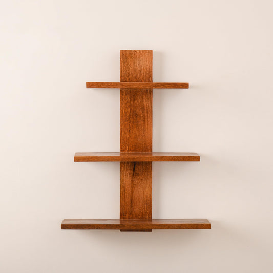WOOD CURLS 3-tier wall-mounted shelf made from natural brown mango wood with a minimalist vertical design.