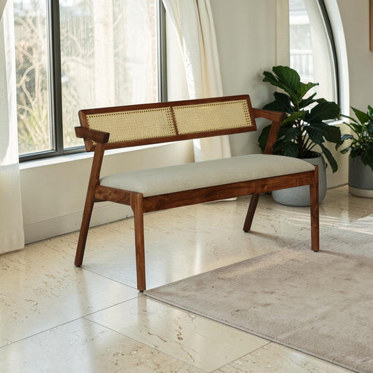 WOOD CURLS Oslen 2-seater bench in acacia wood with a woven cane backrest and a beige suede-finish upholstered seat.