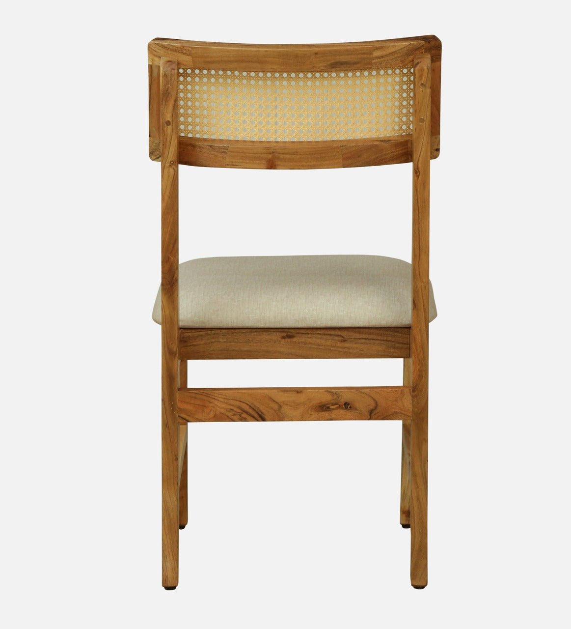 WOOD CURLS Arista dining chair in solid acacia wood with a woven cane backrest and upholstered seat, back view.