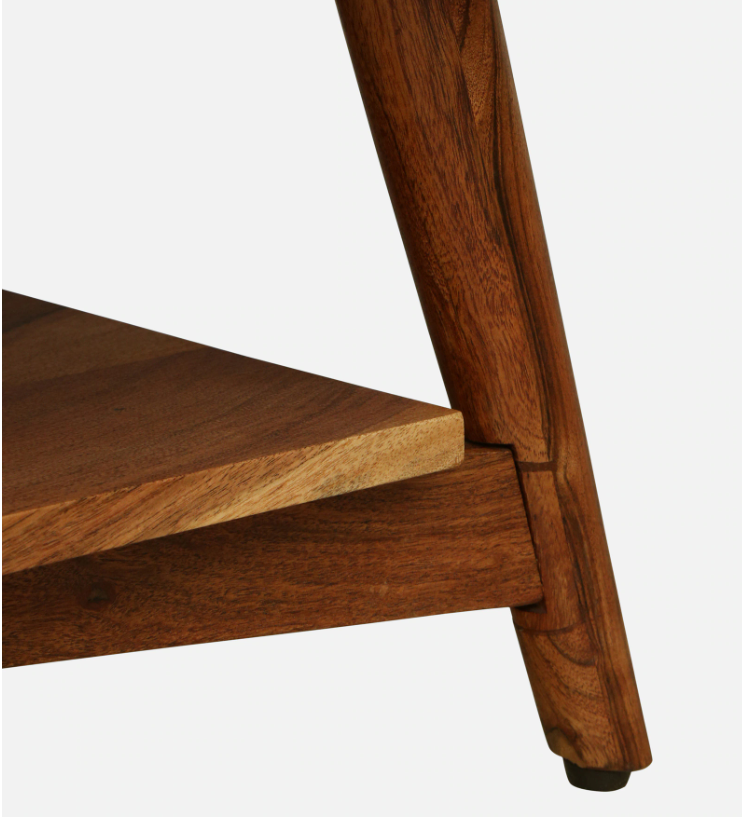 WOOD CURLS Eira coffee table featuring tapered solid acacia wood legs and a lower shelf with natural wood grain