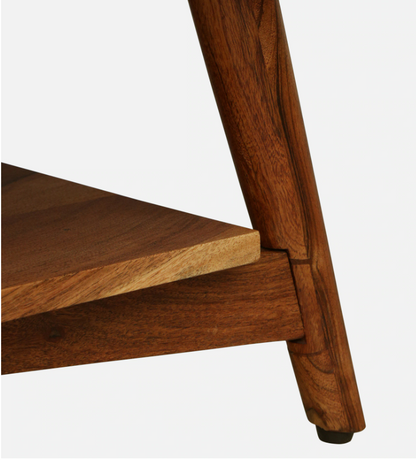 WOOD CURLS Eira coffee table featuring tapered solid acacia wood legs and a lower shelf with natural wood grain
