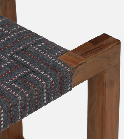 WOOD CURLS Woven Essence 2-seater bench featuring a natural acacia wood frame and grey cotton webbing seat detail.