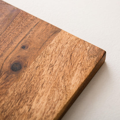 WOOD CURLS long acacia wood charcuterie board showing natural wood grain and smooth polished surface texture