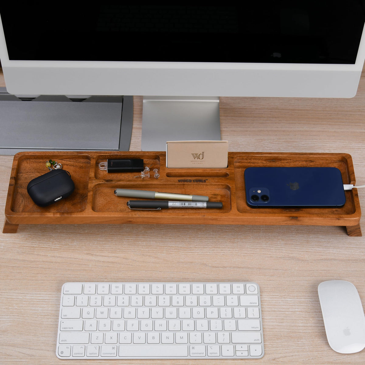 WOOD CURLS handcrafted acacia wood desk organizer with multiple compartments holding stationery and gadgets on a desk