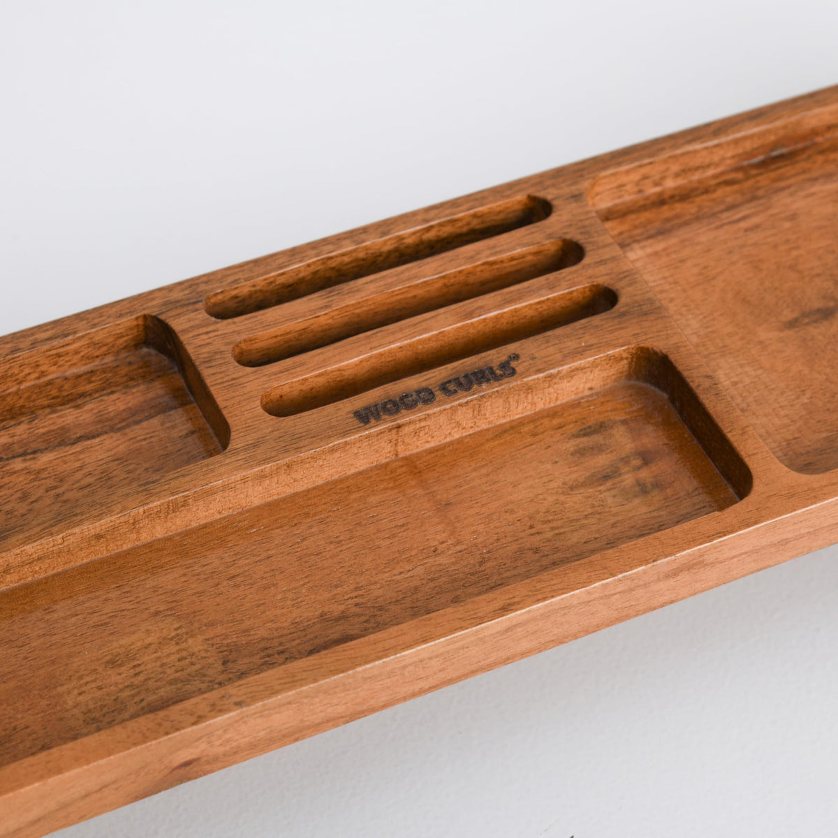 WOOD CURLS handcrafted acacia wood desk organizer with multiple compartments and a natural warm wood grain finish.