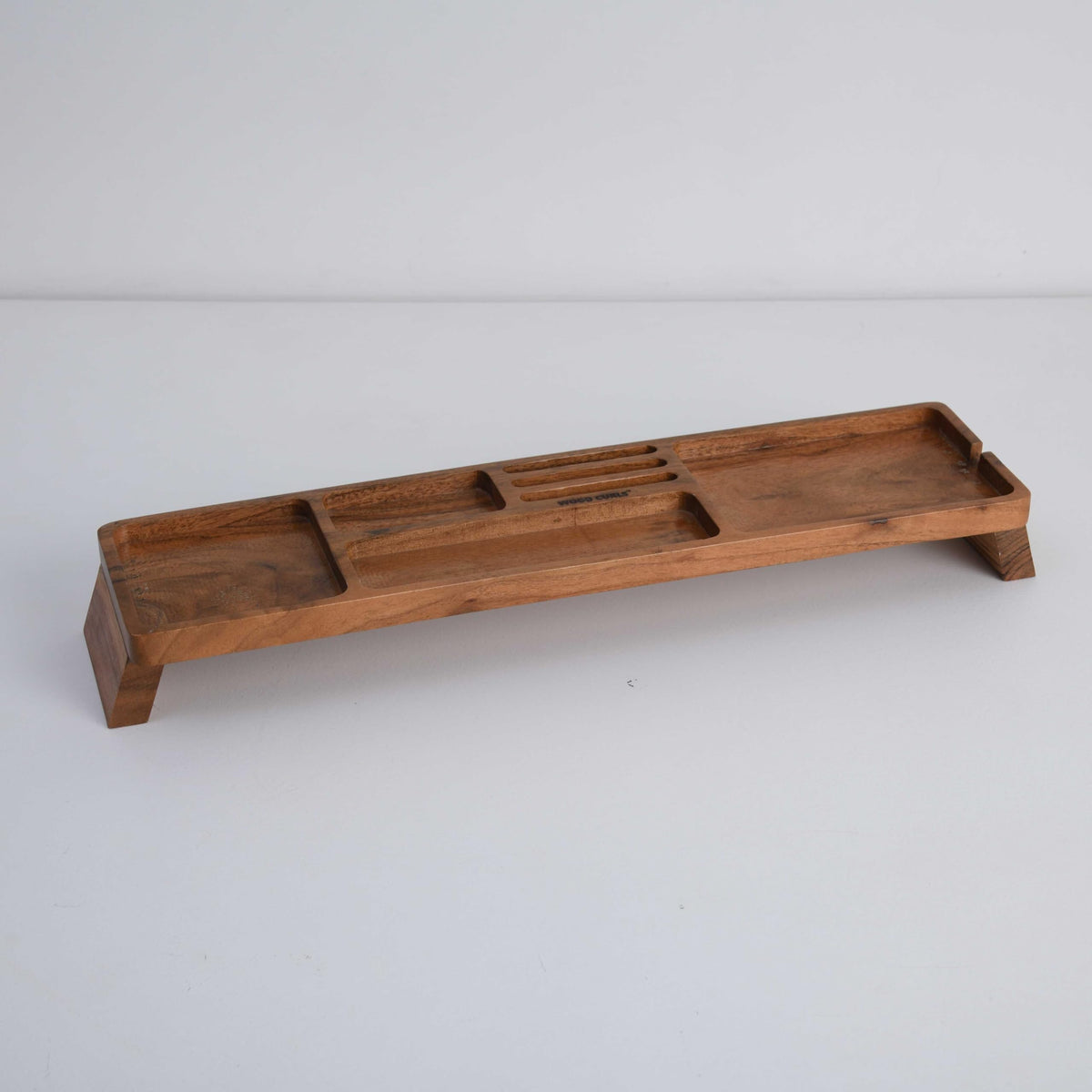 WOOD CURLS handcrafted acacia wood desk organizer with multiple compartments and a natural wood grain finish.