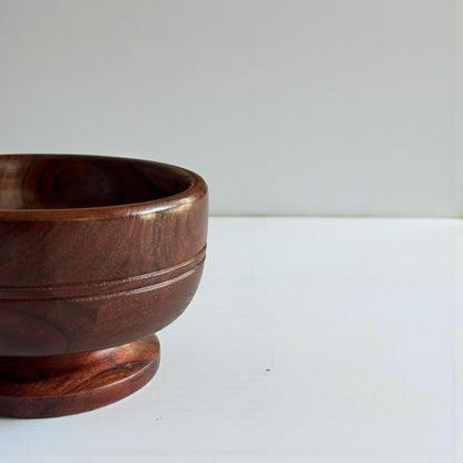 WOOD CURLS small round pedestal serving bowl handcrafted from solid acacia wood with a rich natural grain finish.