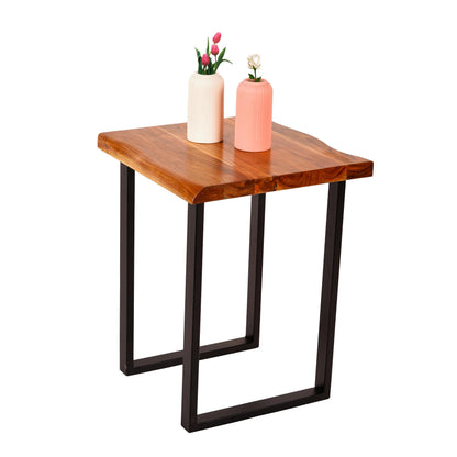 WOOD CURLS square coffee table made of natural acacia wood with a live edge top and sturdy black metal frame.