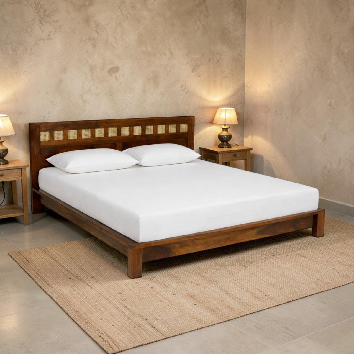 WOOD CURLS Aranya king size bed in solid Sheesham wood with a decorative cane headboard in a modern bedroom setting.
