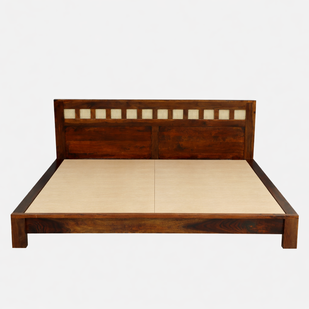 WOOD CURLS Aranya king size bed in solid Sheesham wood with a decorative cane headboard and natural wood finish.