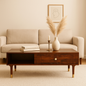 WOOD CURLS Aura coffee table in walnut finish solid Sheesham wood with CNC-carved drawer and gold-tipped legs.