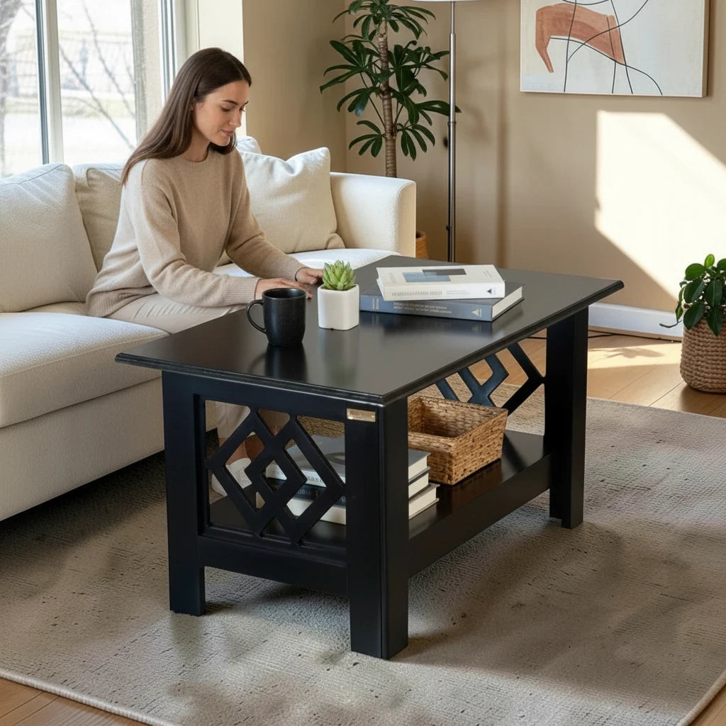 WOOD CURLS modern black wooden coffee table with geometric side panels and lower storage shelf in a living room