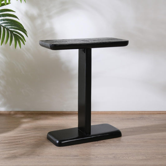 WOOD CURLS black mango wood C-frame side table with a minimalist rectangular top and sturdy pedestal base.