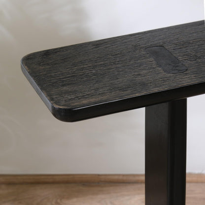 WOOD CURLS modern black mango wood side table with a sleek C-frame design and visible wood grain texture