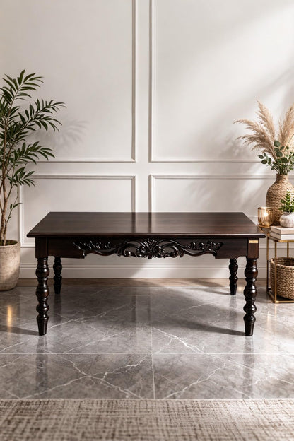 WOOD CURLS handcrafted dark wood coffee table with intricate carved apron and traditional turned legs in a living room.