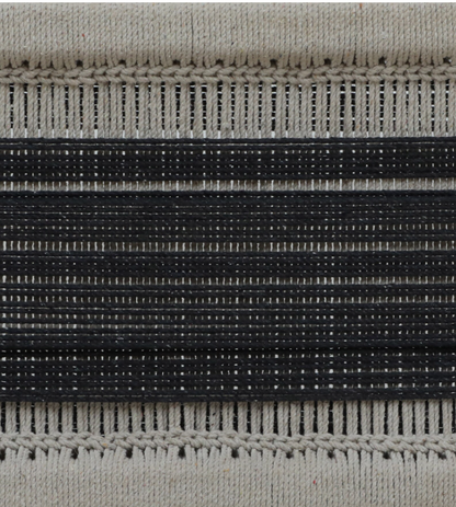 Close-up of WOOD CURLS Eira bench seat featuring hand-woven monochrome cotton rope in black and beige stripes
