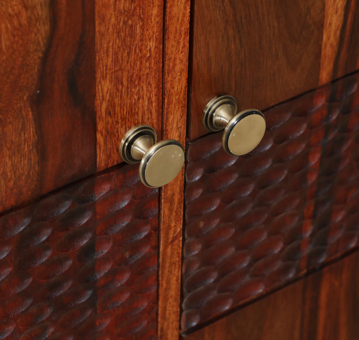 WOOD CURLS Elyssian sideboard featuring honey oak sheesham wood with textured carved detailing and brass knobs