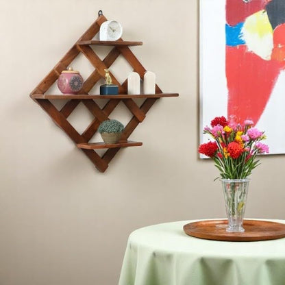WOOD CURLS diamond-shaped mango wood wall shelf with geometric criss-cross design displaying decorative home items.