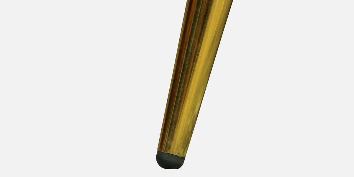 WOOD CURLS Aurelia sofa tapered golden metal leg with a protective black floor cap against a white background
