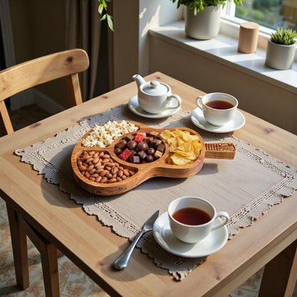 WOOD CURLS guitar shaped wooden serving platter with divided compartments filled with snacks on a dining table