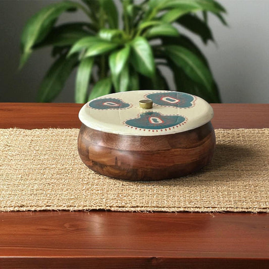 WOOD CURLS handcrafted mango wood roti box with a teal and coral hand-painted lid on a rustic dining table.