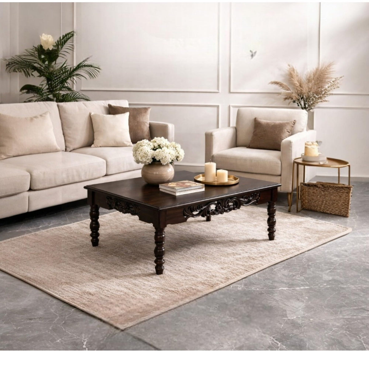 WOOD CURLS handcrafted dark wood center table with intricate carvings and turned legs in a bright living room