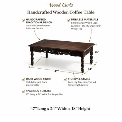 WOOD CURLS handcrafted rectangular coffee table in dark wood with intricate carved apron and traditional turned legs.