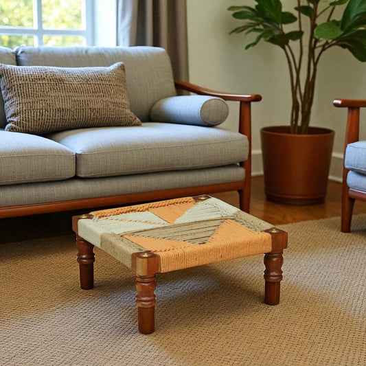 WOOD CURLS handwoven wooden chowki with geometric rope pattern in natural and peach tones for seating or footrest.