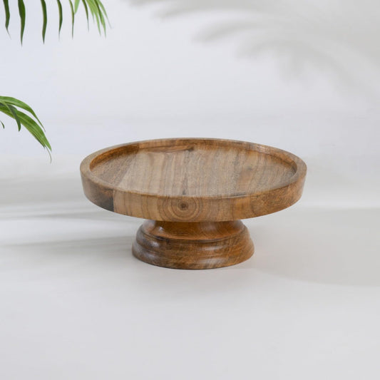 WOOD CURLS round mango wood pedestal cake stand with a natural grain finish for dessert display and table decor.
