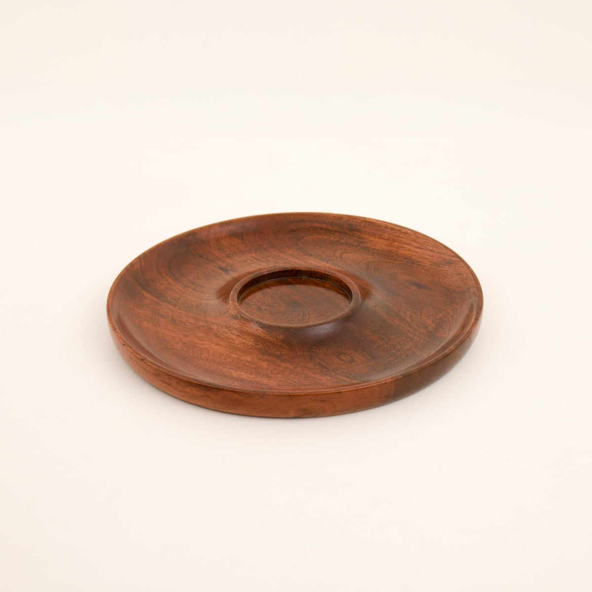 WOOD CURLS handcrafted round mango wood chip and dip serving platter with a smooth dark natural grain finish.