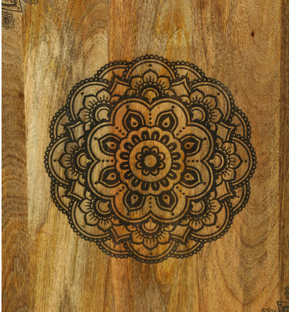 WOOD CURLS handcrafted mango wood cabinet door featuring an intricate, detailed circular mandala carving pattern.