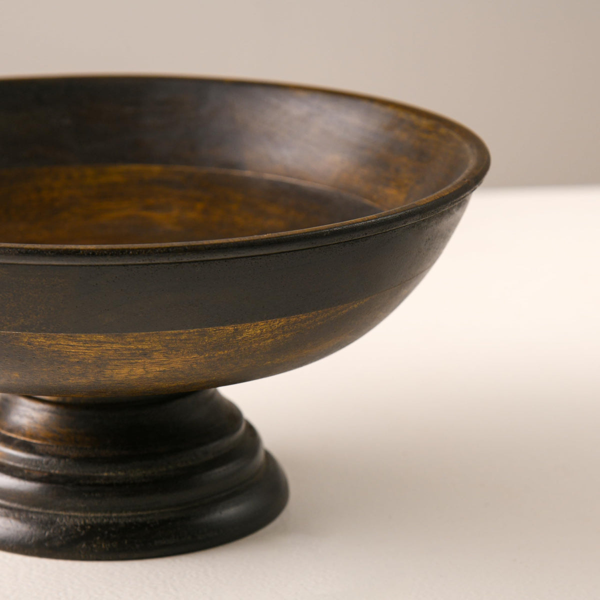 WOOD CURLS handcrafted mango wood pedestal bowl with a natural walnut finish, perfect for fruit or table decor.
