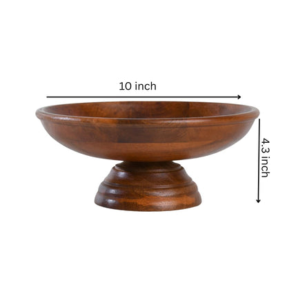 WOOD CURLS handcrafted mango wood pedestal fruit bowl with a 10-inch diameter and warm natural wood grain finish.