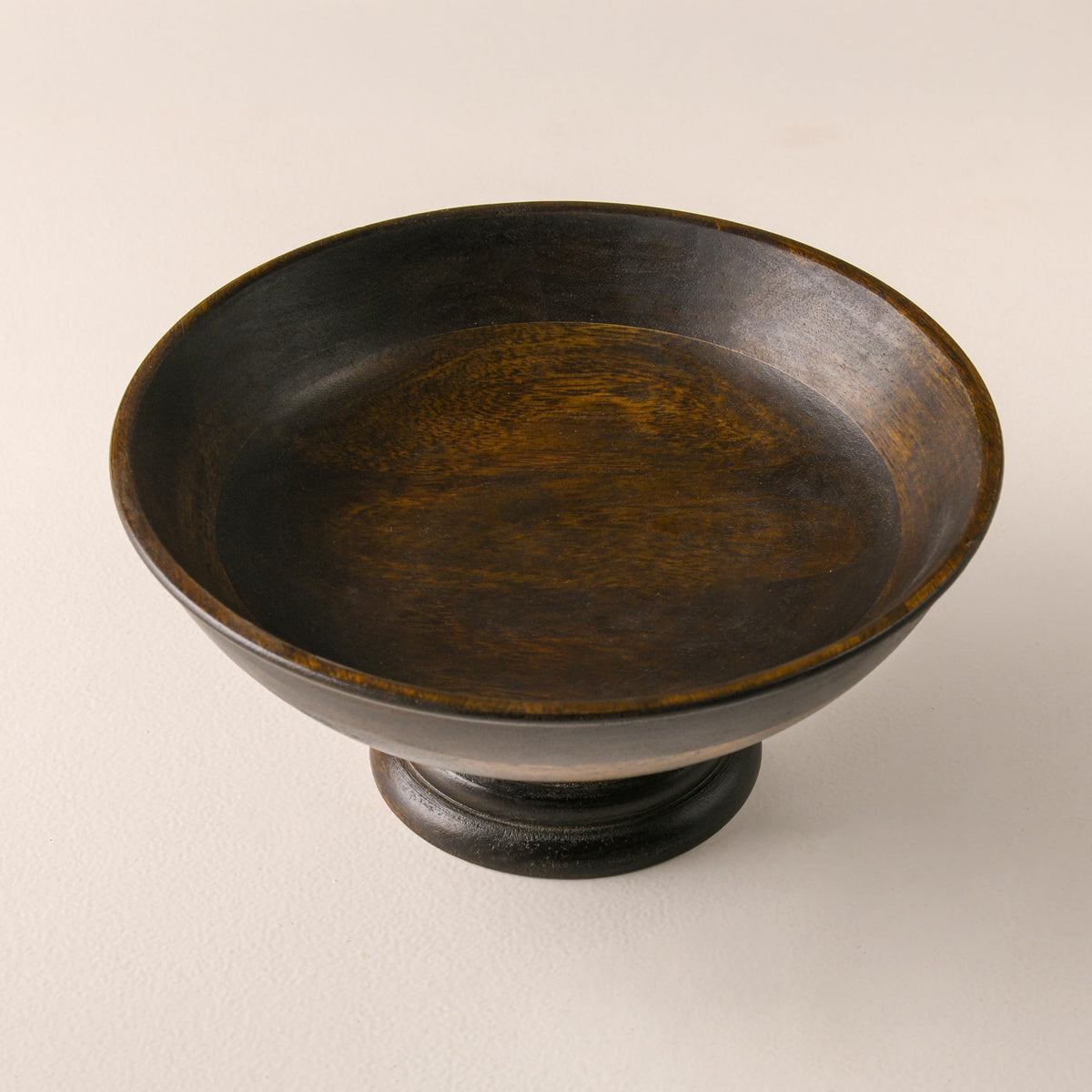 WOOD CURLS handcrafted mango wood pedestal bowl with a natural walnut finish, perfect for fruit or table decor.