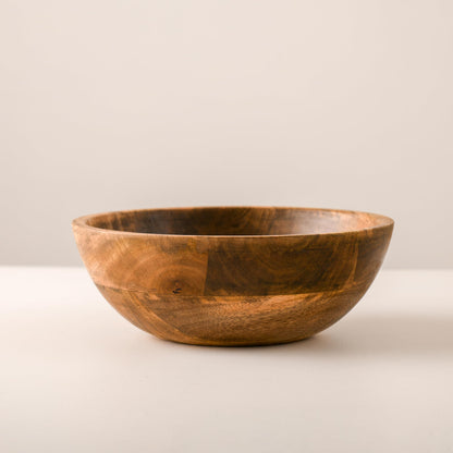 WOOD CURLS 10-inch round mango wood serving bowl with natural grain, perfect for salads, fruits, or table decor.