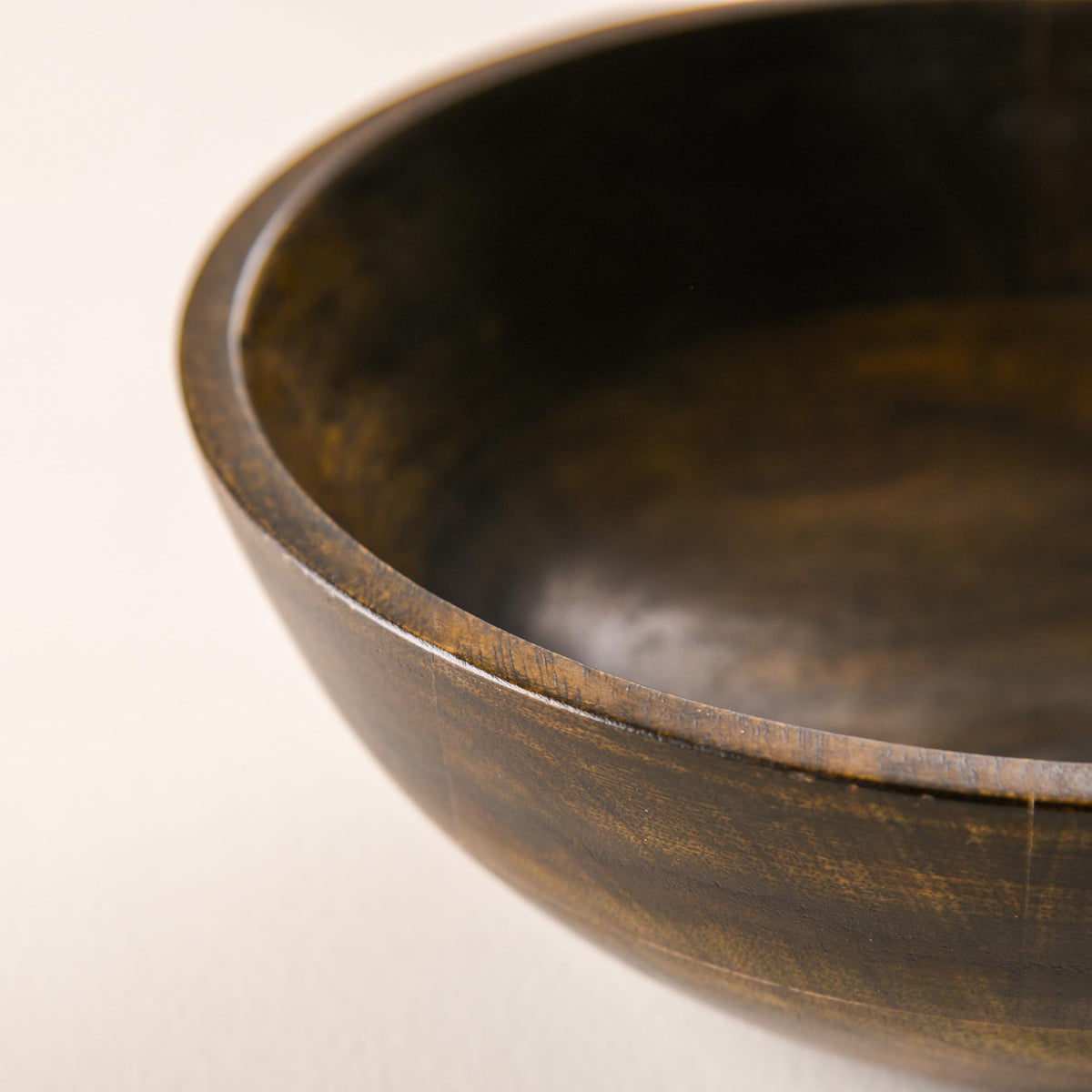 WOOD CURLS 10-inch round mango wood serving bowl with a rich walnut finish and visible natural wood grain texture.