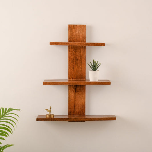 WOOD CURLS 3-tier wall-mounted shelf made of natural brown mango wood with a minimalist vertical design.