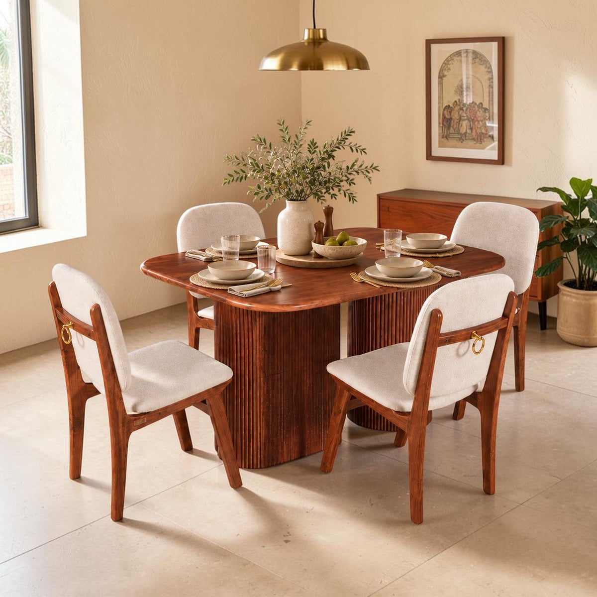 WOOD CURLS Marlow 4 seater dining set with acacia wood table featuring a fluted pedestal and upholstered chairs.