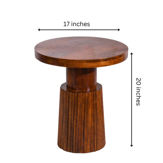 WOOD CURLS Nyx round coffee table in natural mango wood with a fluted pedestal base, 17 inches wide and 20 inches high.