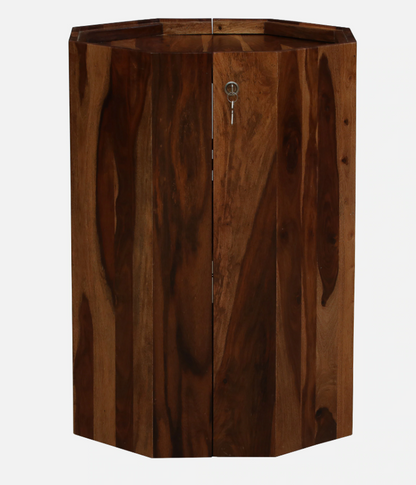 WOOD CURLS octagon bar cabinet in solid Sheesham wood with a natural finish and visible grain texture.