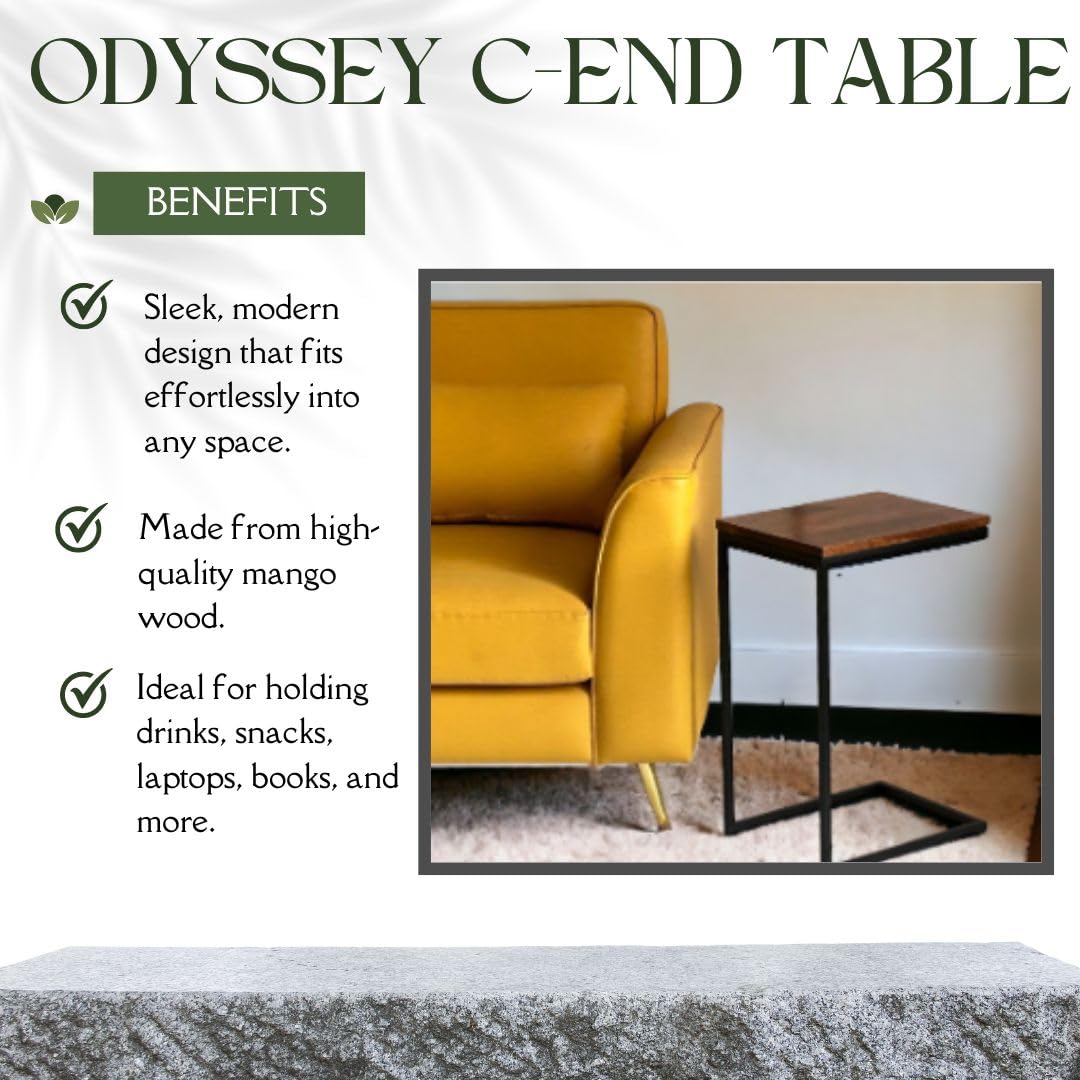 WOOD CURLS Odyssey C-shape side table with a warm mango wood top and black iron frame next to a yellow sofa.