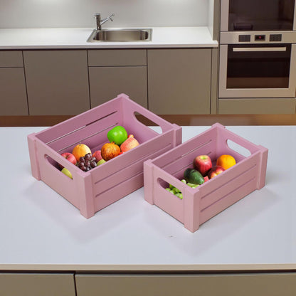 WOOD CURLS set of two pink wooden storage crates with handles, filled with fresh fruit on a modern kitchen counter.