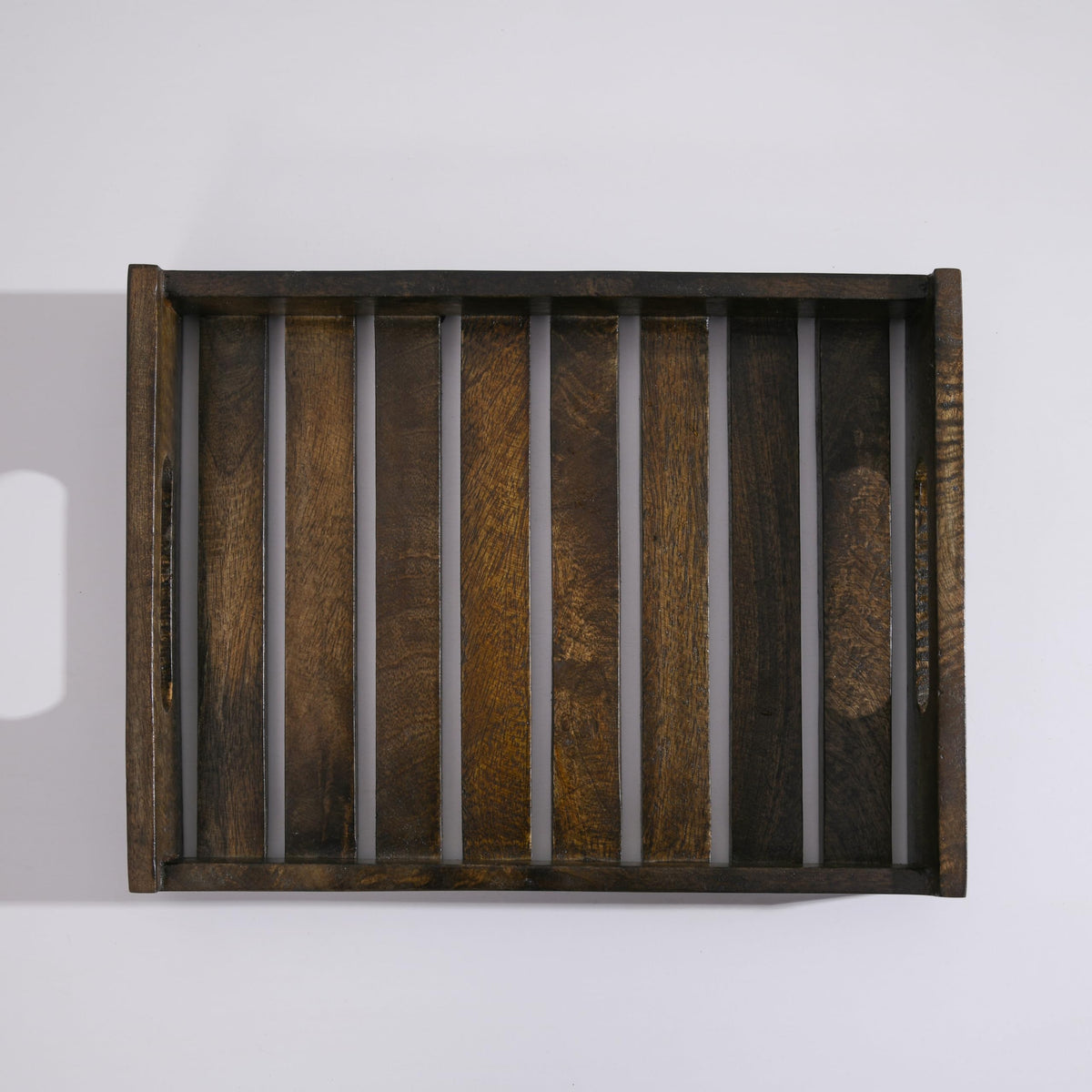 WOOD CURLS rectangular mango wood serving tray with a slatted base and dark natural finish for home or café use.