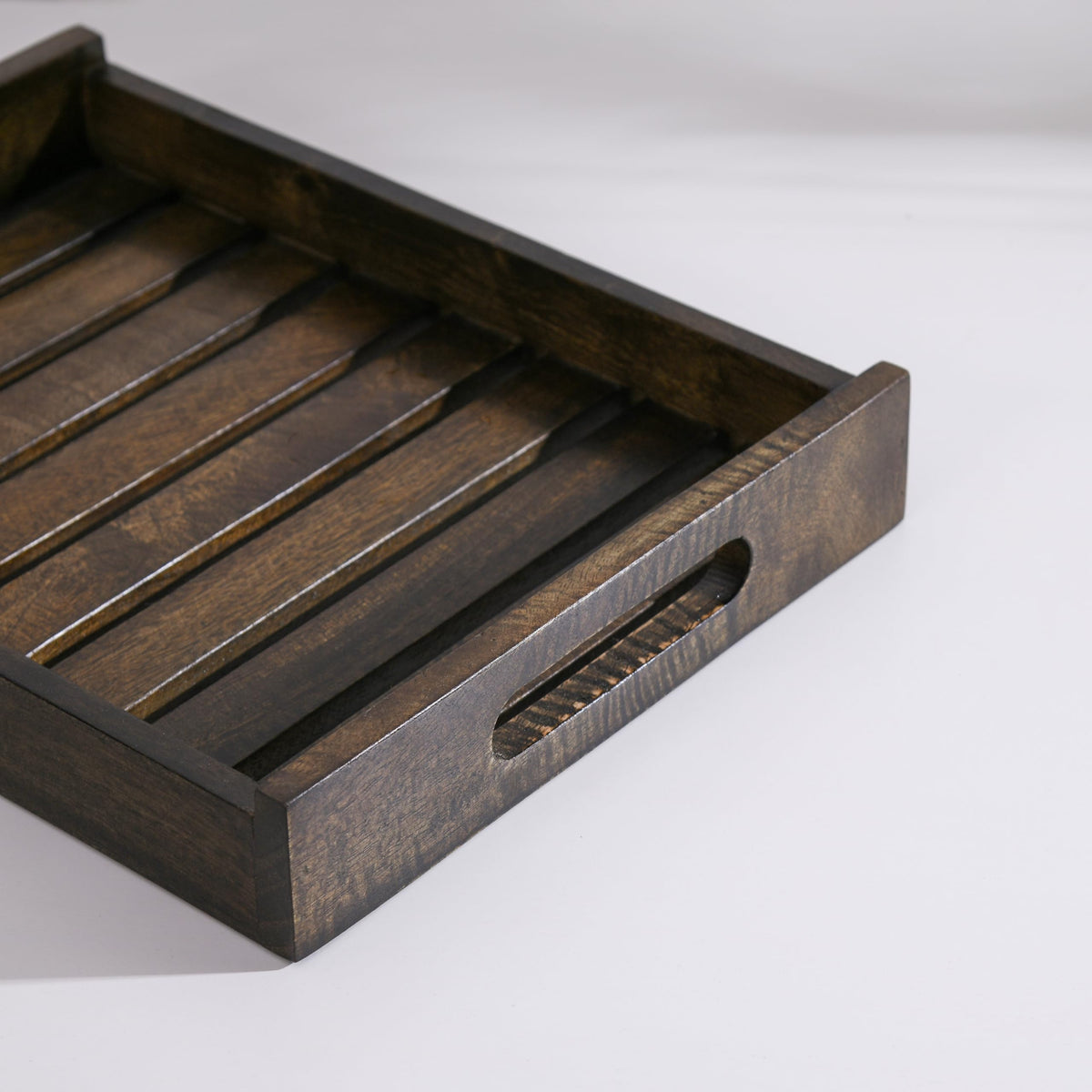 WOOD CURLS rectangular mango wood serving tray with a dark natural finish and integrated side handles